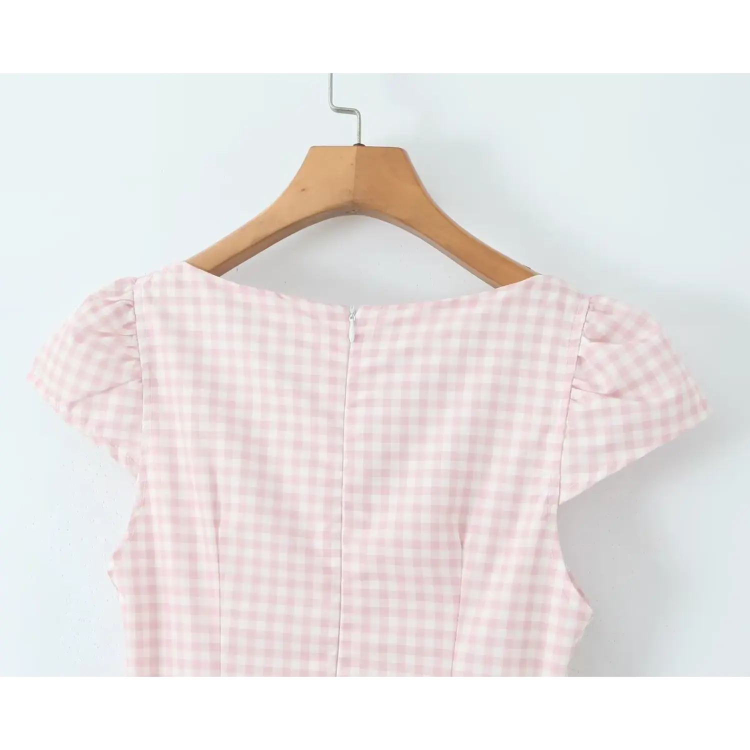 Close‑up back neck center zipper and cap sleeve shoulder pink gingham midi dress
