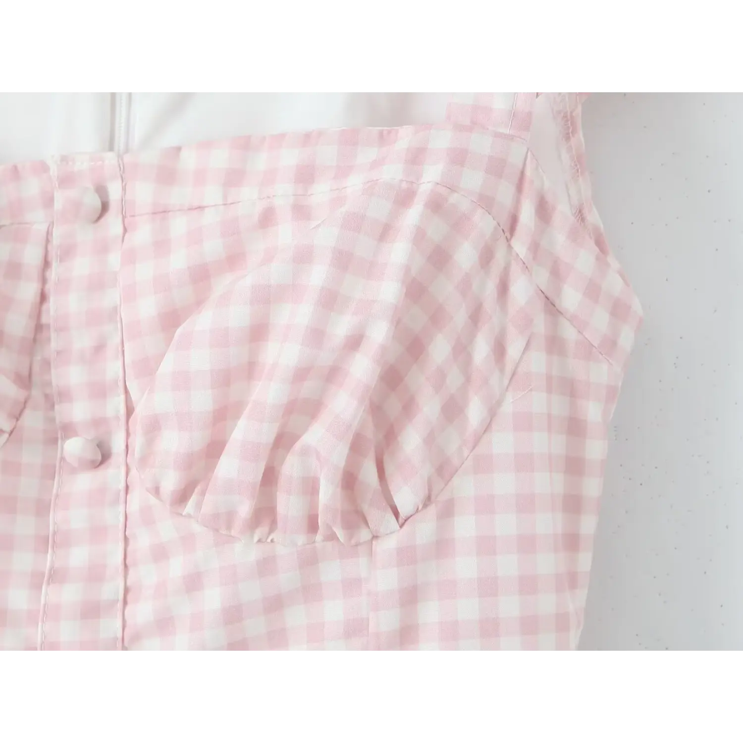 Close‑up bust ruched gathering and front faux covered buttons pink gingham midi dress