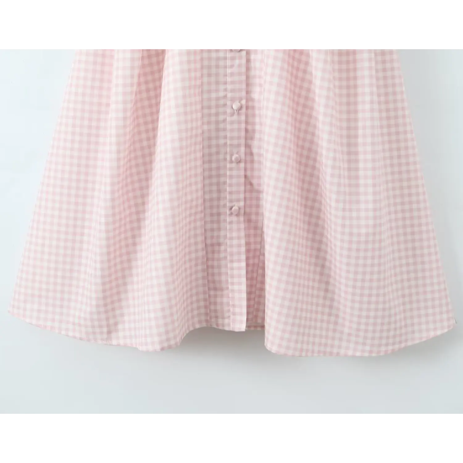 Partial shot a‑line skirt hem front covered button placket pink gingham midi dress