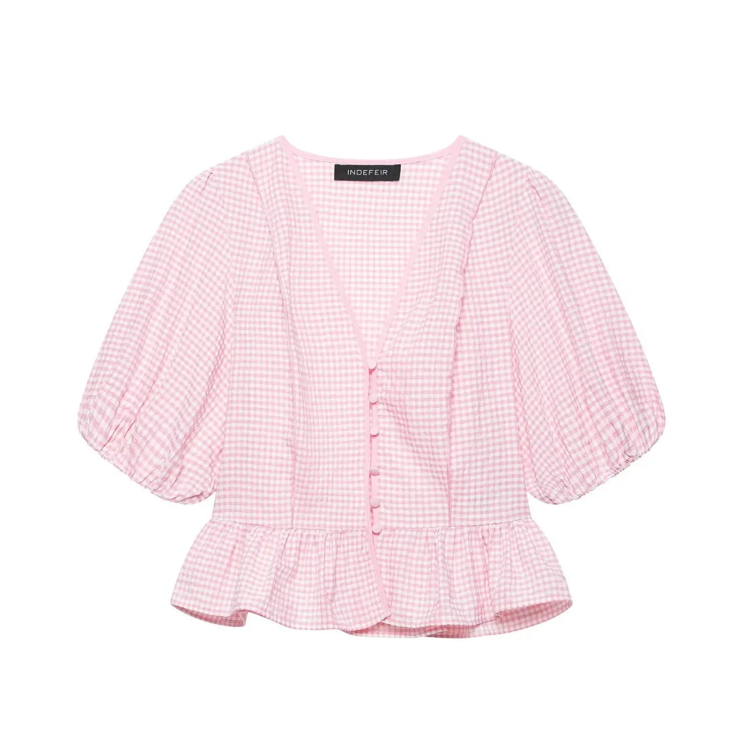 Full front flat lay main shot of light pink gingham blouse, v-neckline, front fabric button placket, puff short sleeves, ruffled peplum hem, crinkle lightweight woven fabric