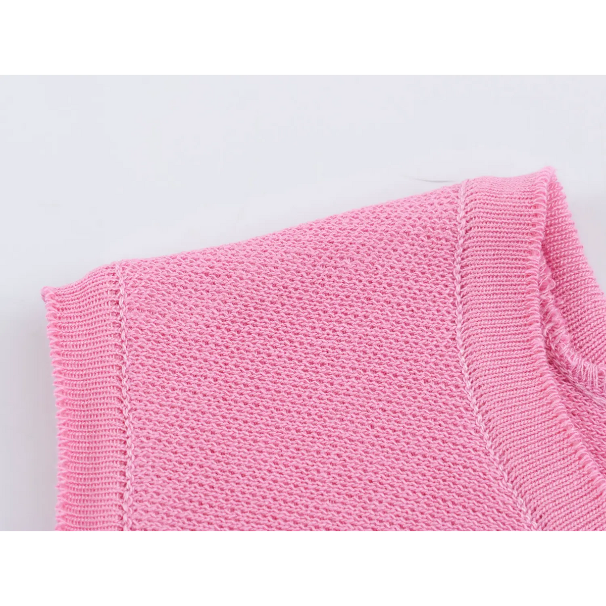 Close-up of armhole binding and knit stitch