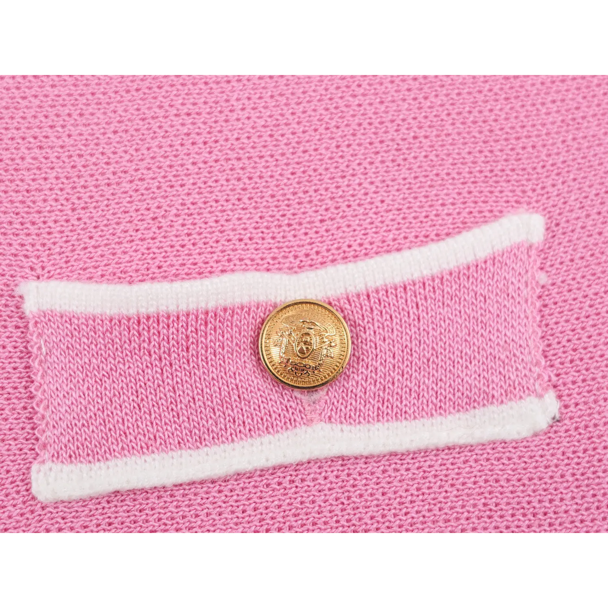 Close-up of embossed gold metal button