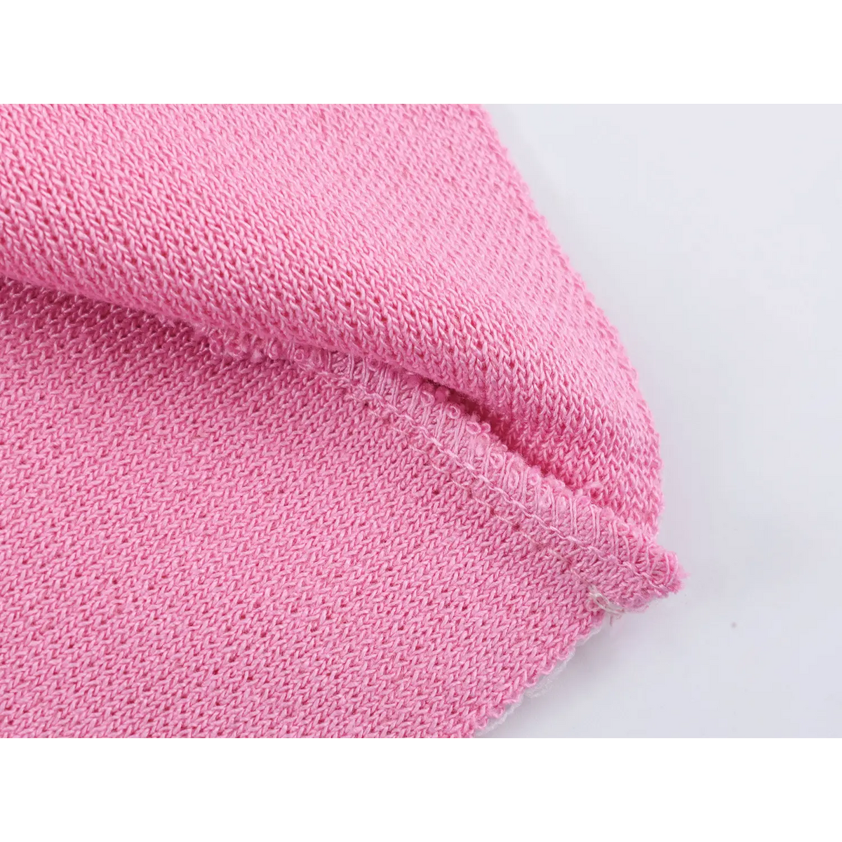 Close-up of hem stitching and knit fabric