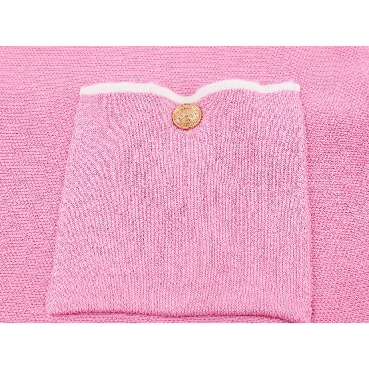 Close-up of patch pocket and gold button