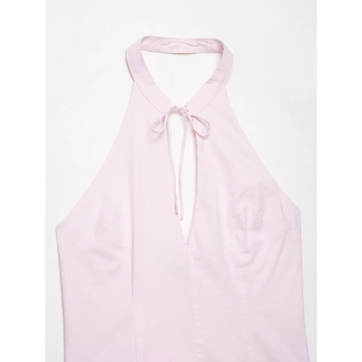 Top view of the dress's front, showing the full halter neckline and tie.