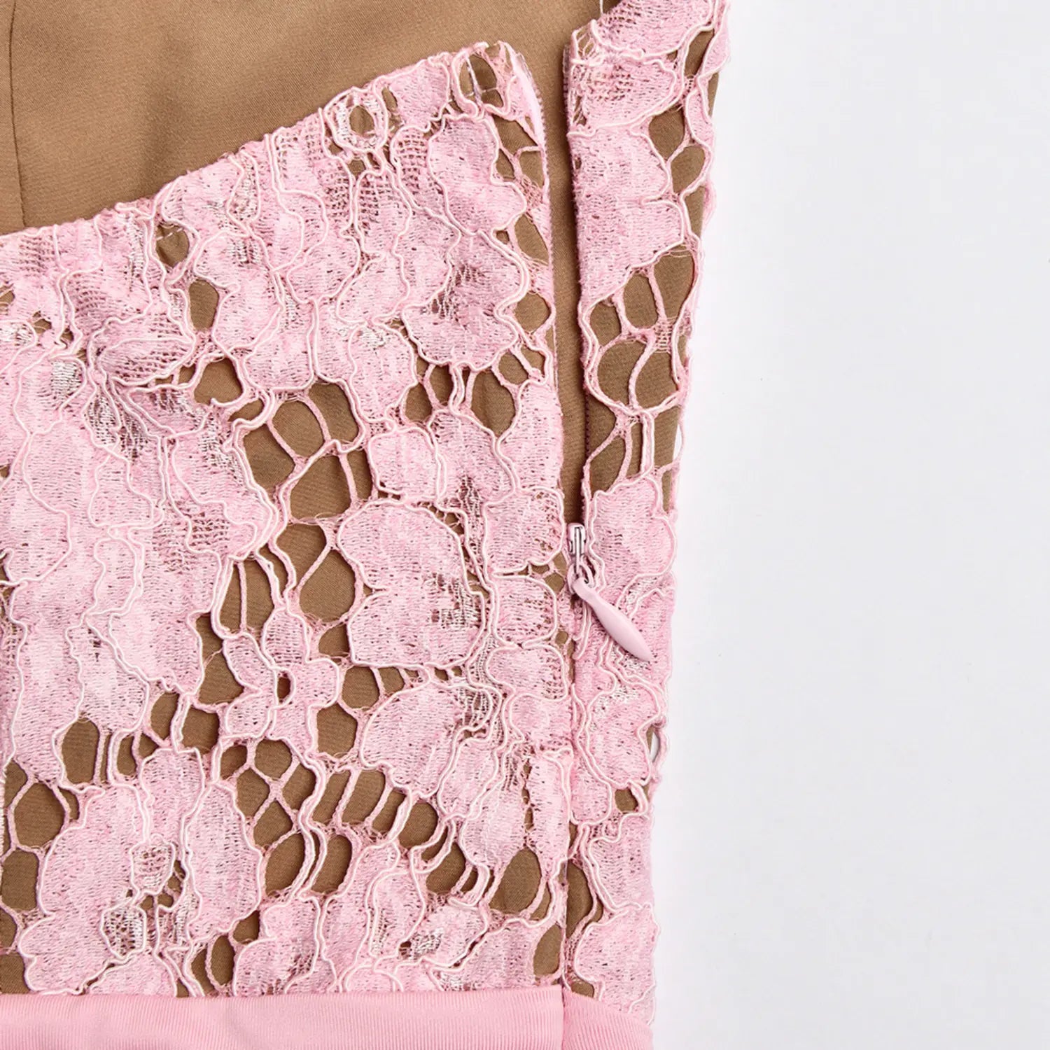 Close‑up side invisible zipper on pink floral lace bodice