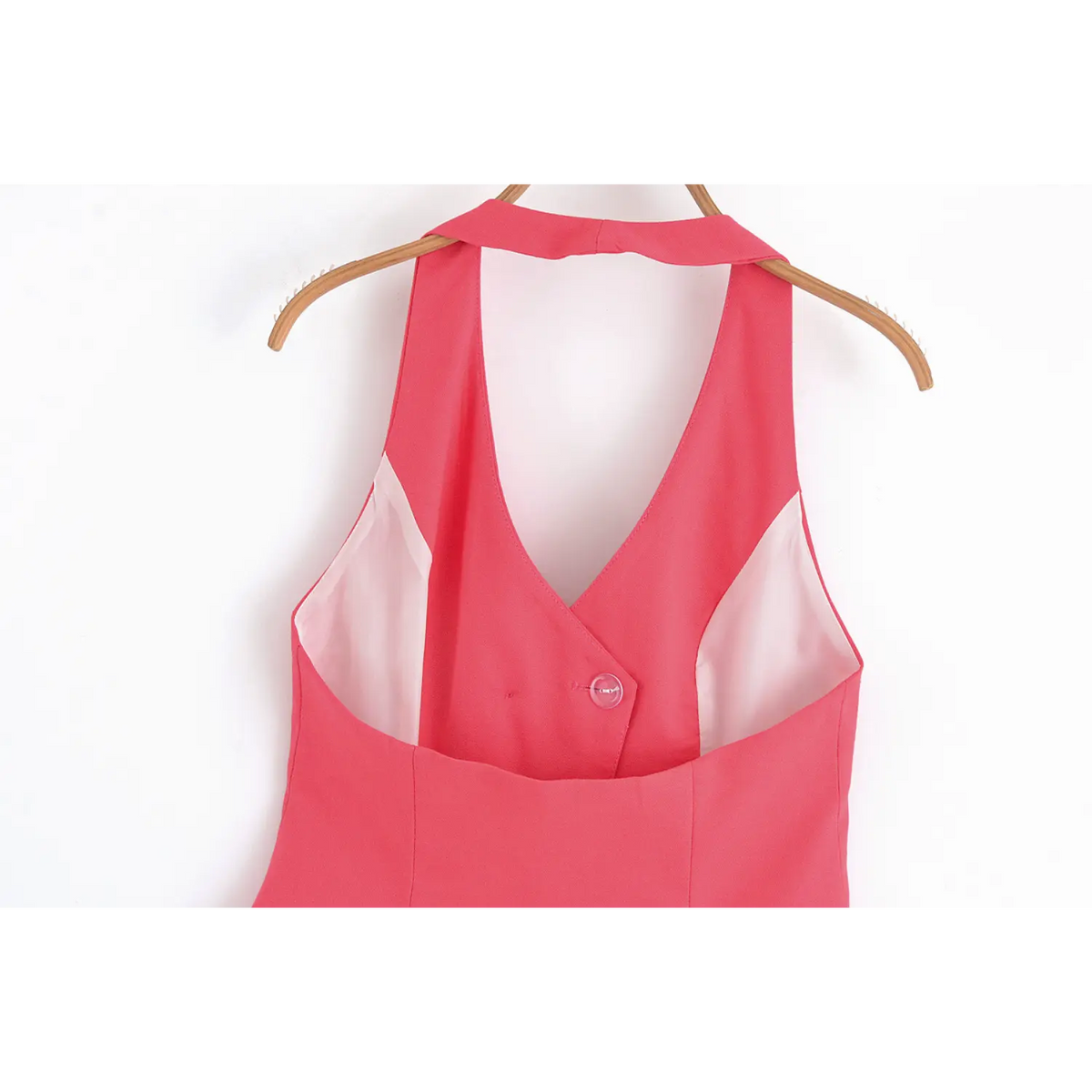 Back view of pink halter neck waistcoat on hanger