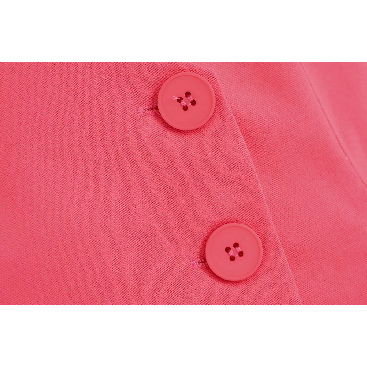 Close-up of two covered buttons