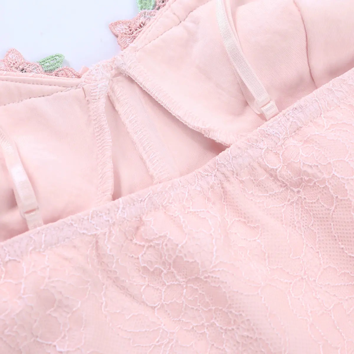 Inner view of the bustier top, showing the boning, adjustable straps, and smooth lining