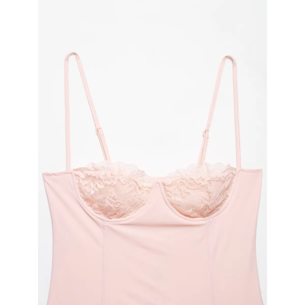 Full front shot of the pink camisole, showing the adjustable straps, lace cups, and fitted silhouette.