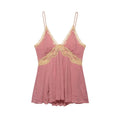 Front view of a pink peplum cami top with beige lace trim, V-neckline, and flowy hem.