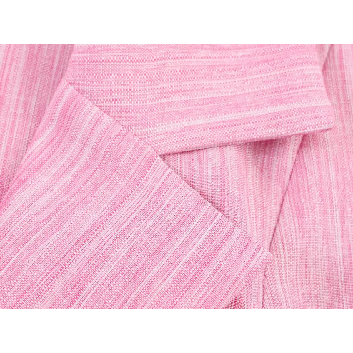 Close-up detail shot of the textured pink linen fabric on a blazer dress, showing the woven pattern and heathered color.