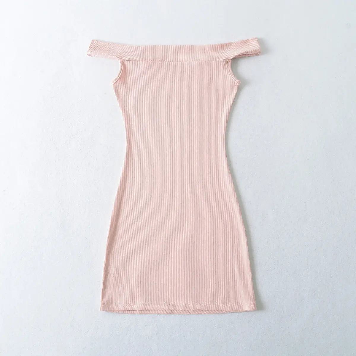 Back view of a pink ribbed off-shoulder dress, showing the fitted silhouette.
