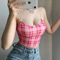 Mirror selfie model shot pink plaid cropped cami top with white bow accents