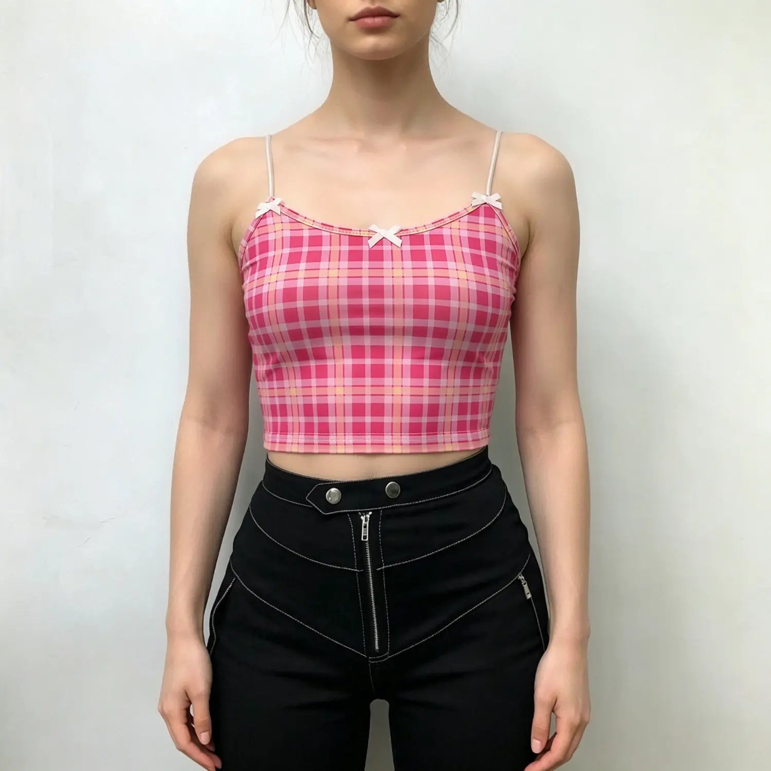 Model front full view pink gingham plaid cropped cami top with white tiny bow decor and thin spaghetti straps