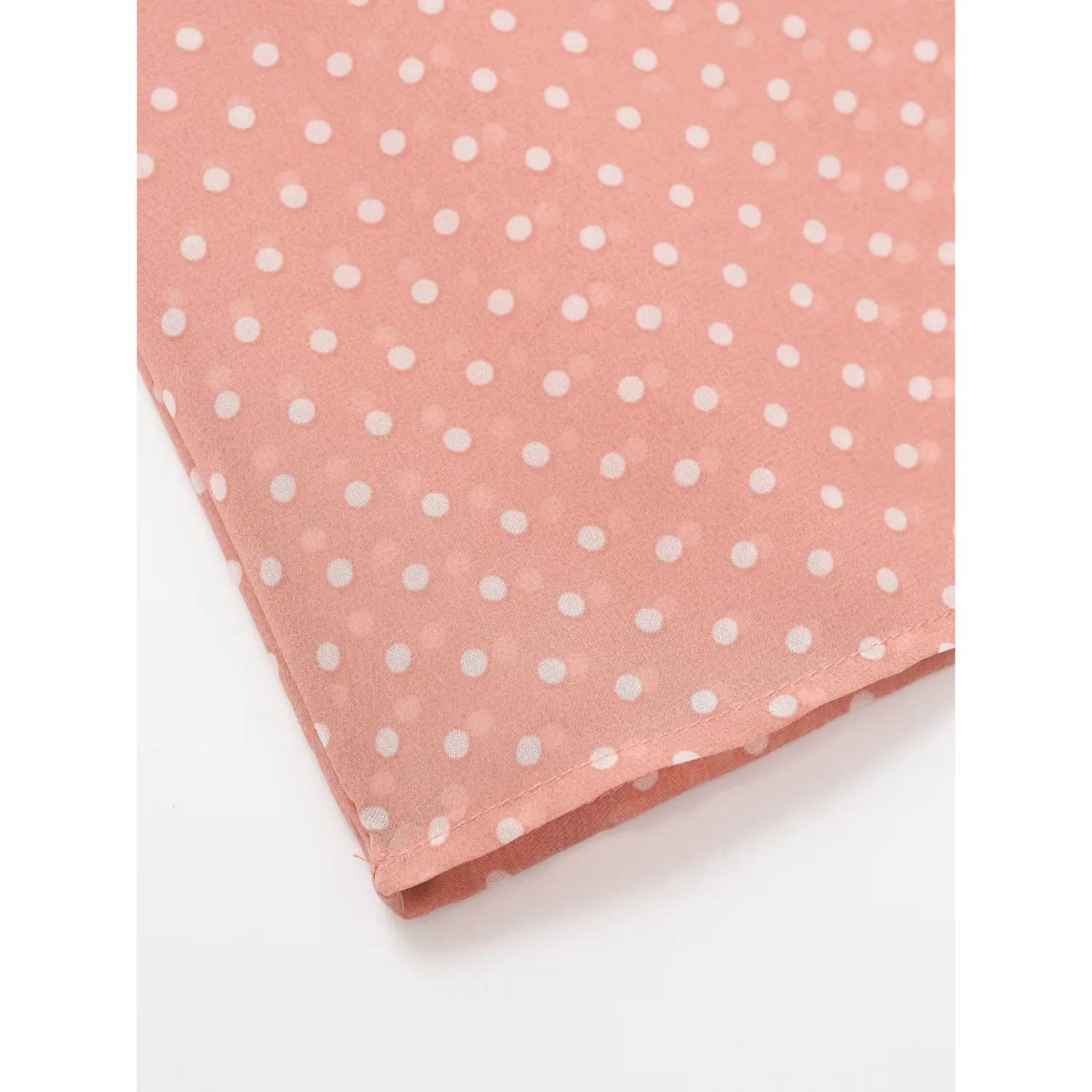 Bottom hem stitching detail of pink polka dot chiffon blouse, finished narrow hem