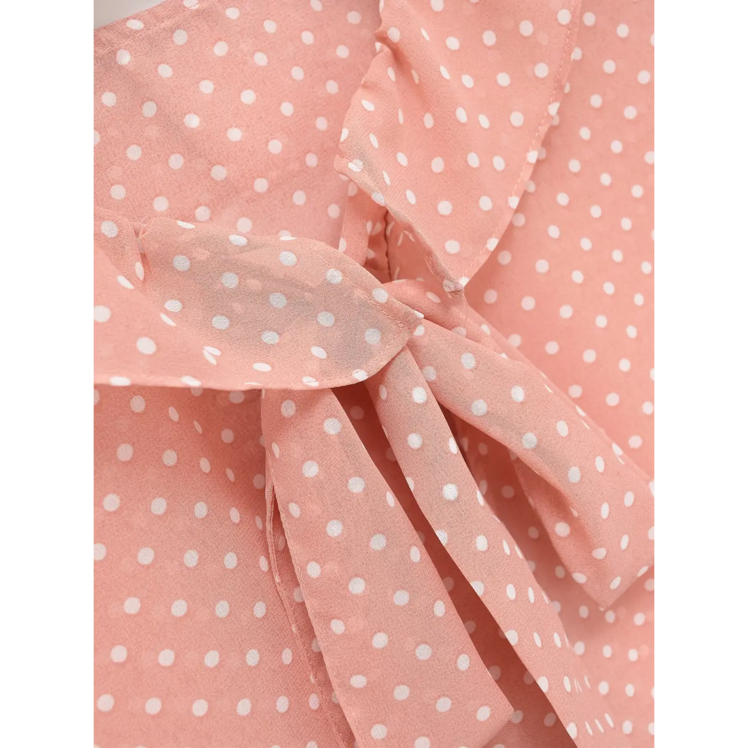  Macro close-up of front tie bow, sheer polka dot chiffon material and finished edge details