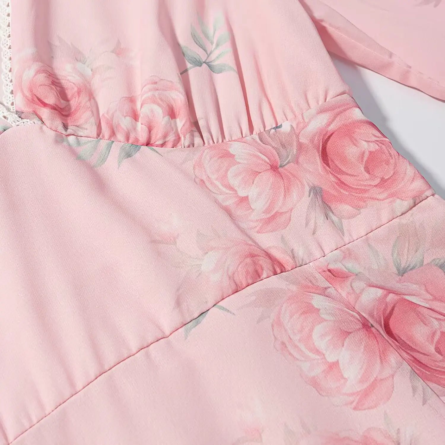 Draped fabric texture shot, soft crinkled chiffon, scattered watercolor pink rose blossom print