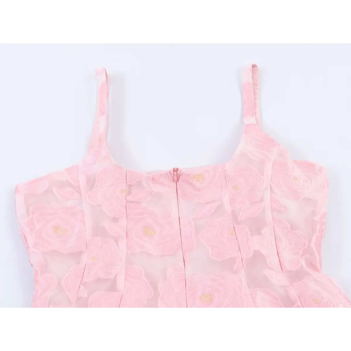 Close-up back view of the square neckline and zipper on a pink rose-embroidered organza sundress.