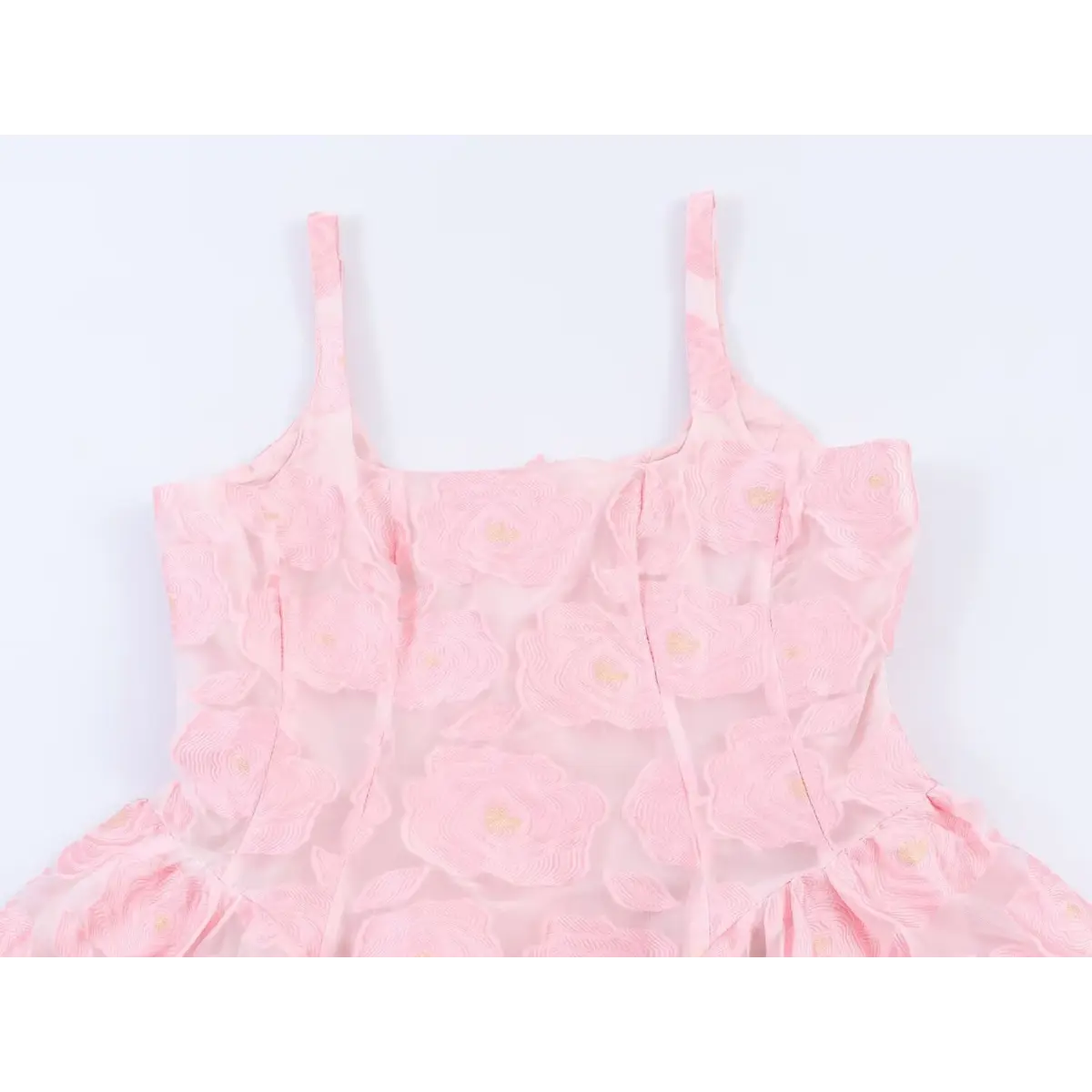 Close-up back view of the square neckline and zipper on a pink rose-embroidered organza sundress.