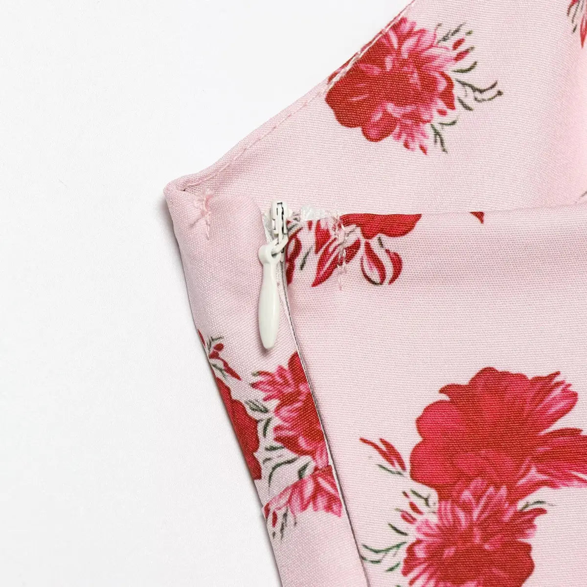 Close-up of the invisible side zipper on the pink rose floral cami dress