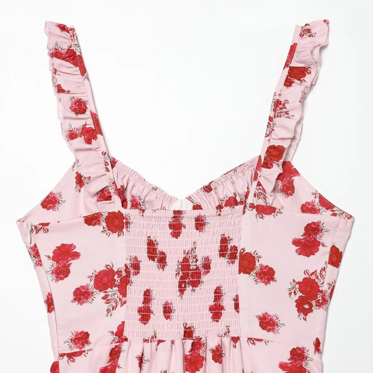 Close-up of the ruffled shoulder straps and sweetheart neckline on the pink floral cami dress