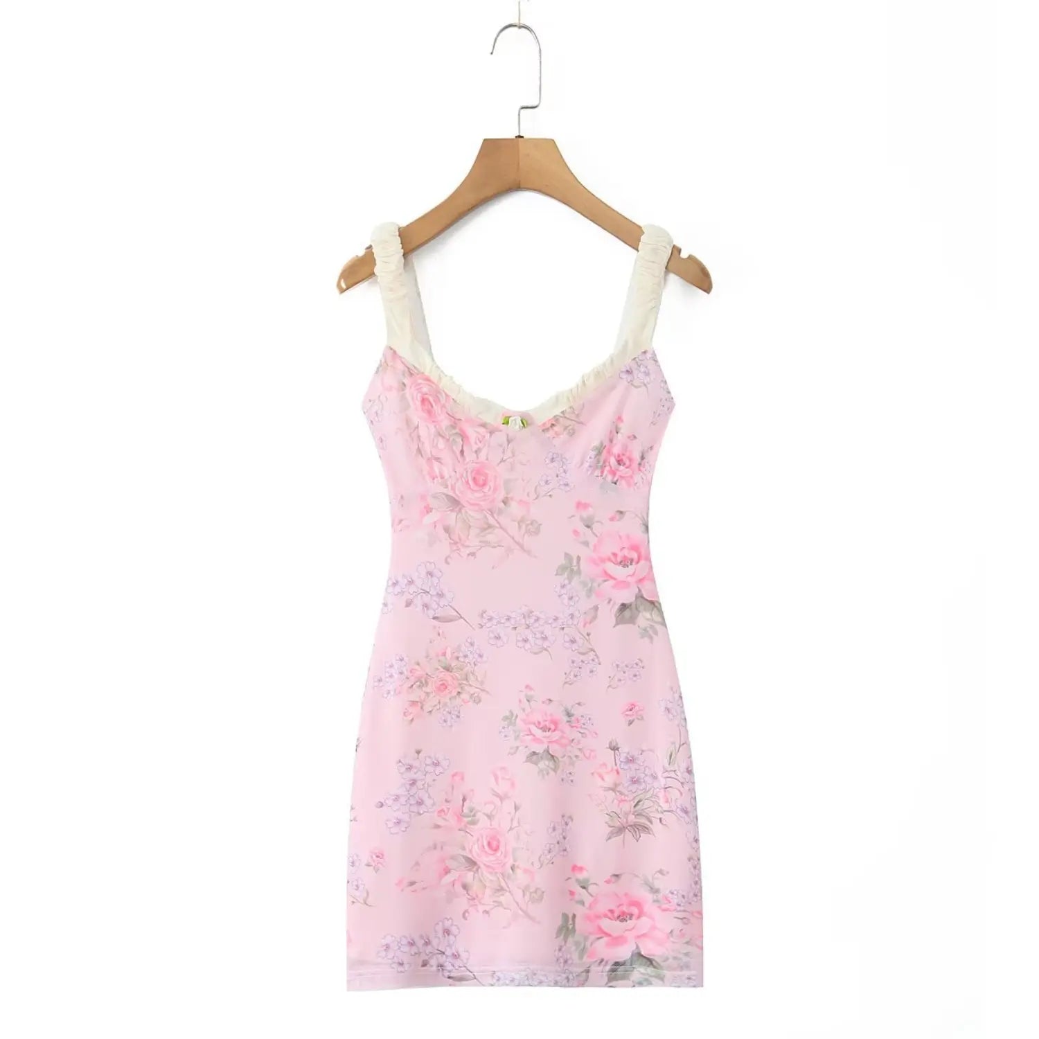Pink floral mesh mini dress on wooden hanger, cream ruched cami straps, v‑neck with small rose applique, vintage rose print, front view