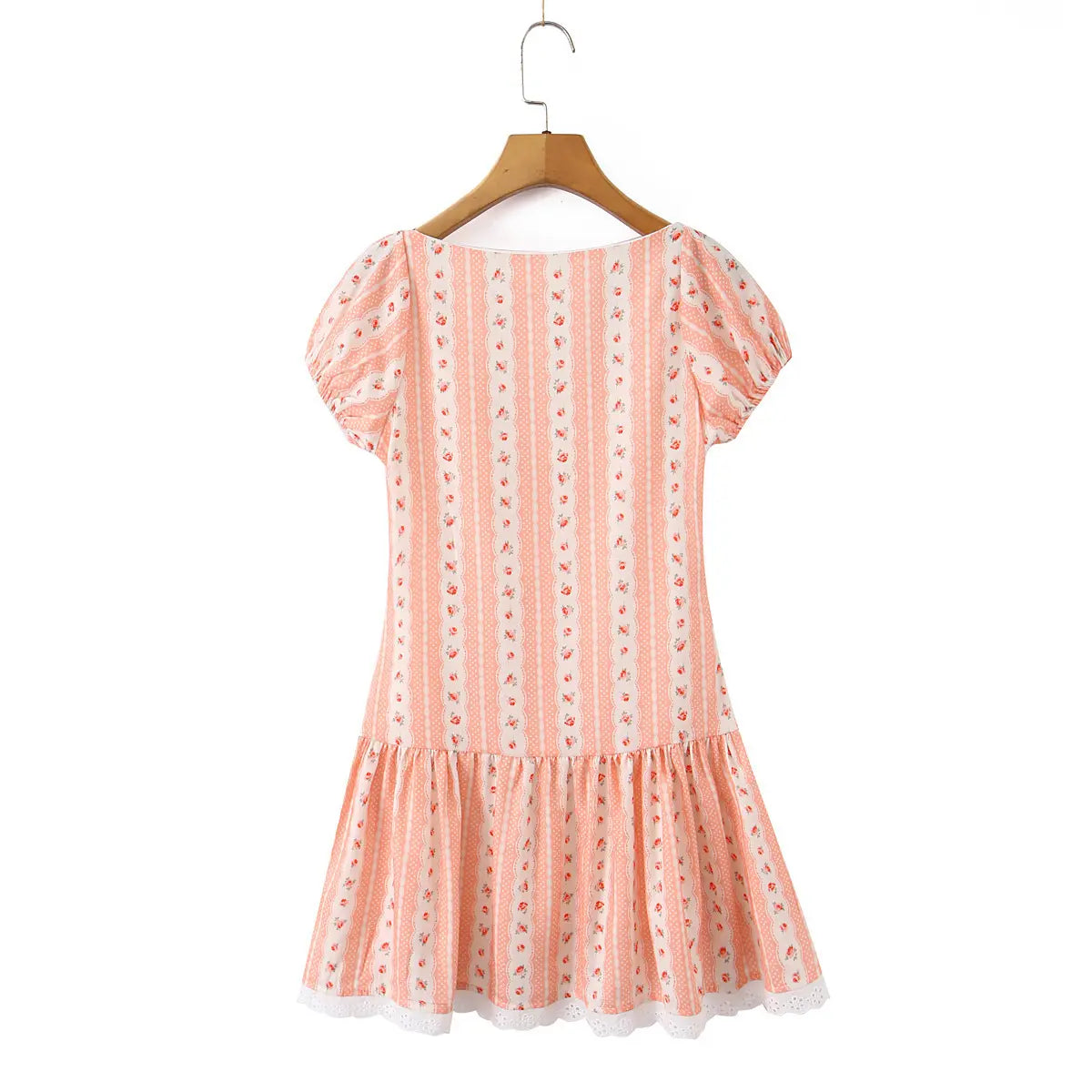 Full back view of the dress, showcasing the square neckline, puff sleeves, and flared ruffled hem with lace trim.