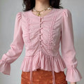 Model front view wearing pink ruched bell sleeve cropped blouse
