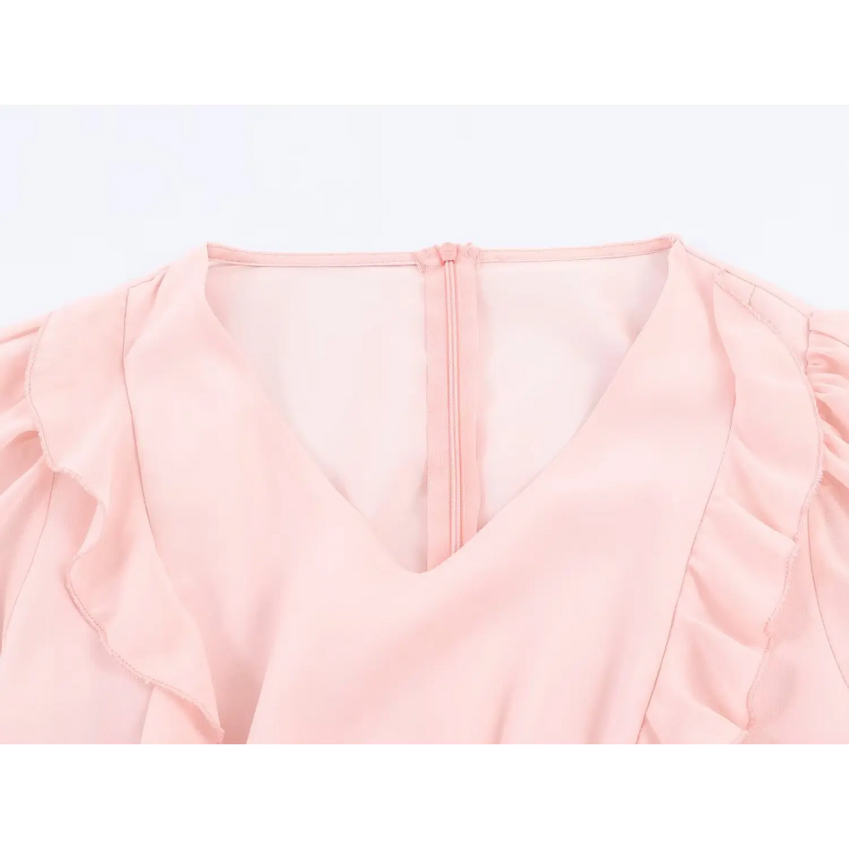 Close up of v neckline with ruffle detail, hidden back zipper on pink chiffon maxi dress