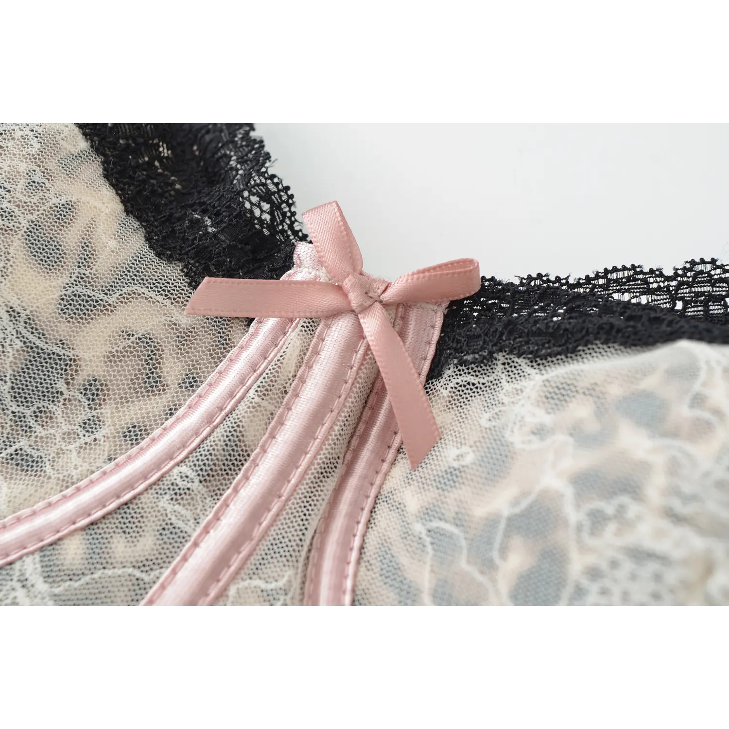 Pink satin handmade bow leopard corset tank bust close-up, scalloped black lace edge double layer leopard lace mesh fabric white background shot