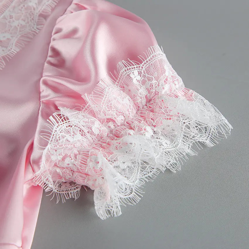 Close-up of puff sleeve and white eyelash lace cuff
