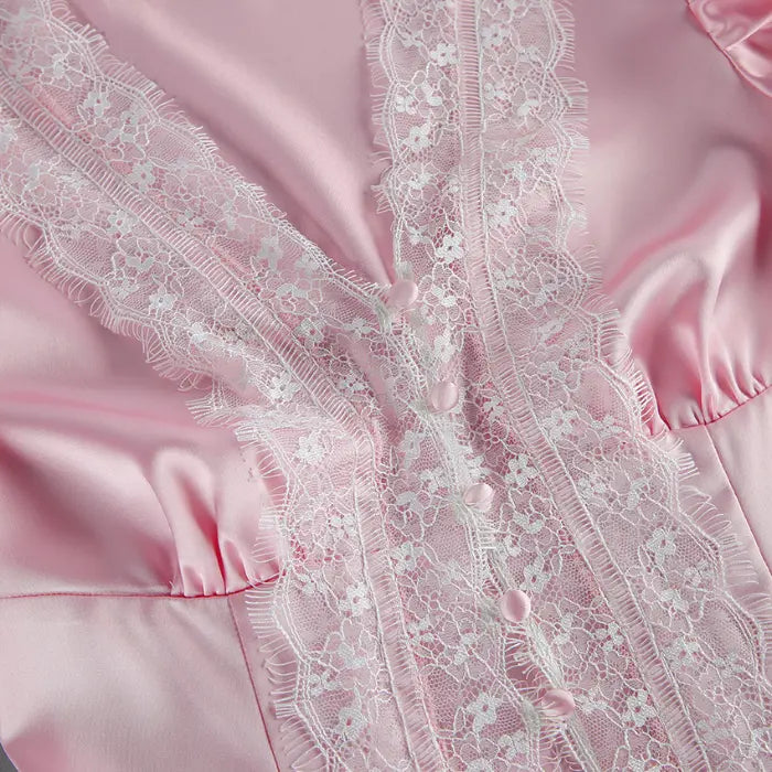 Close-up of white eyelash lace V neck button placket