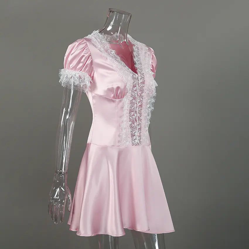 Pink satin lace trim puff sleeve mini dress on mannequin, three quarter view