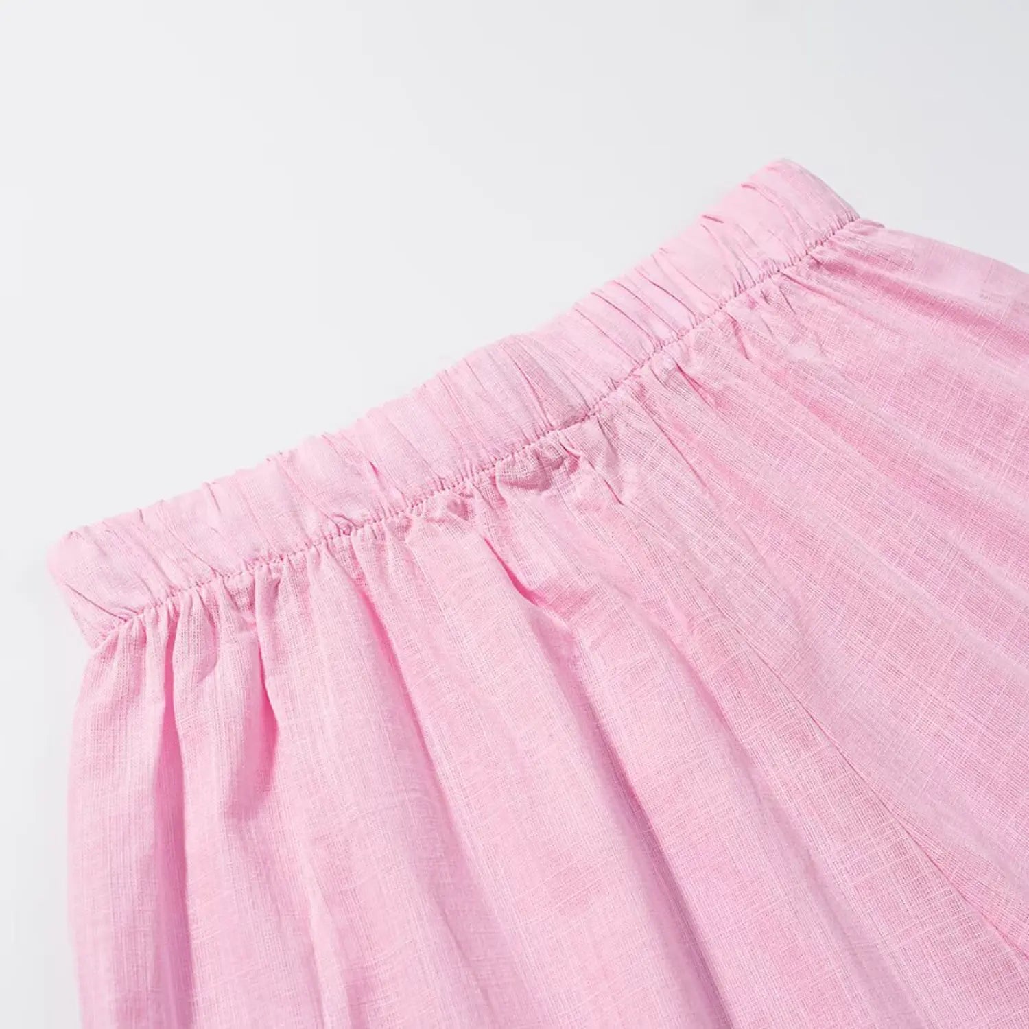 Side waist partial shot, full wide elastic shirred waist, lightweight textured pink woven fabric