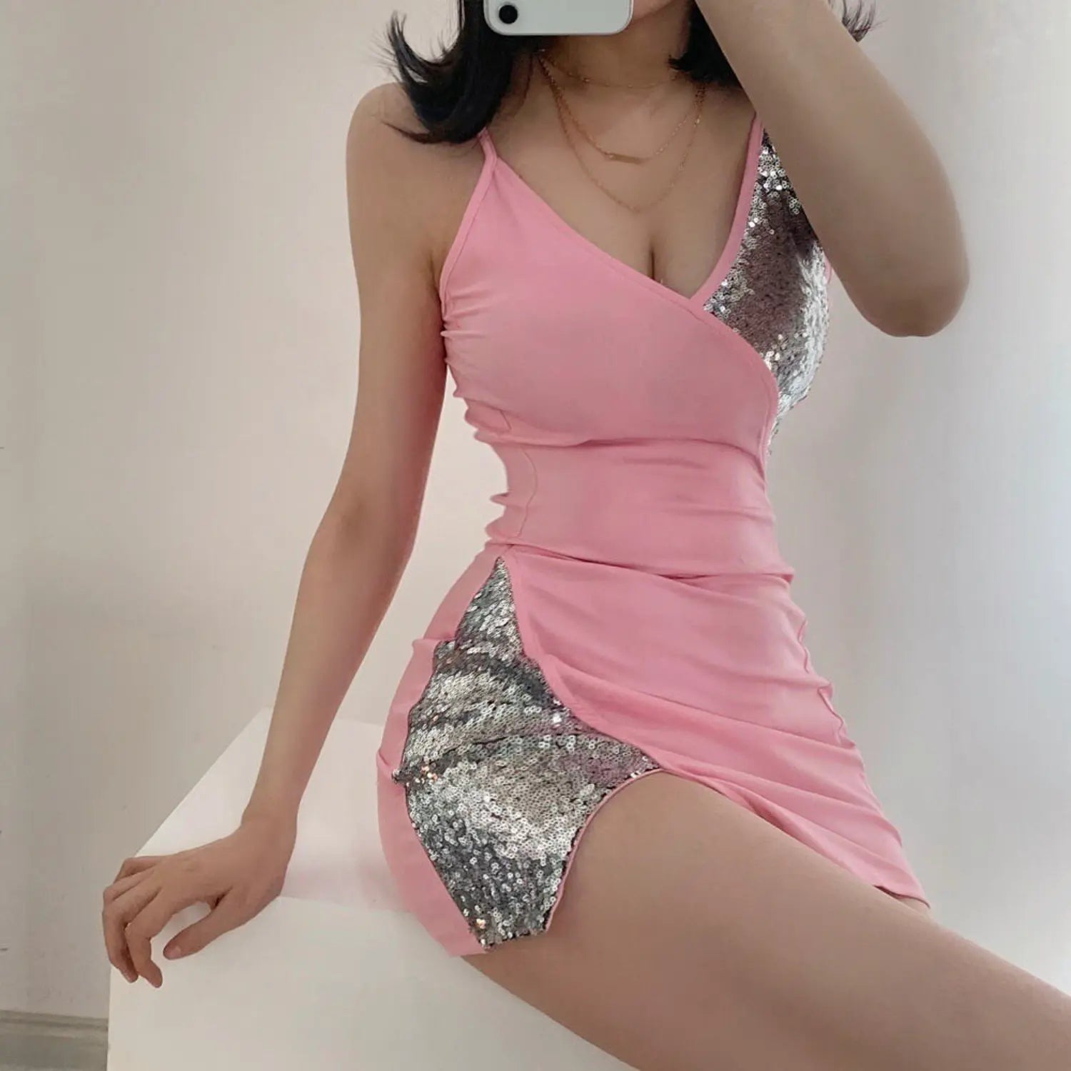 Selfie model wearing pink spaghetti strap v neck silver sequin spliced high slit bodycon mini party dress