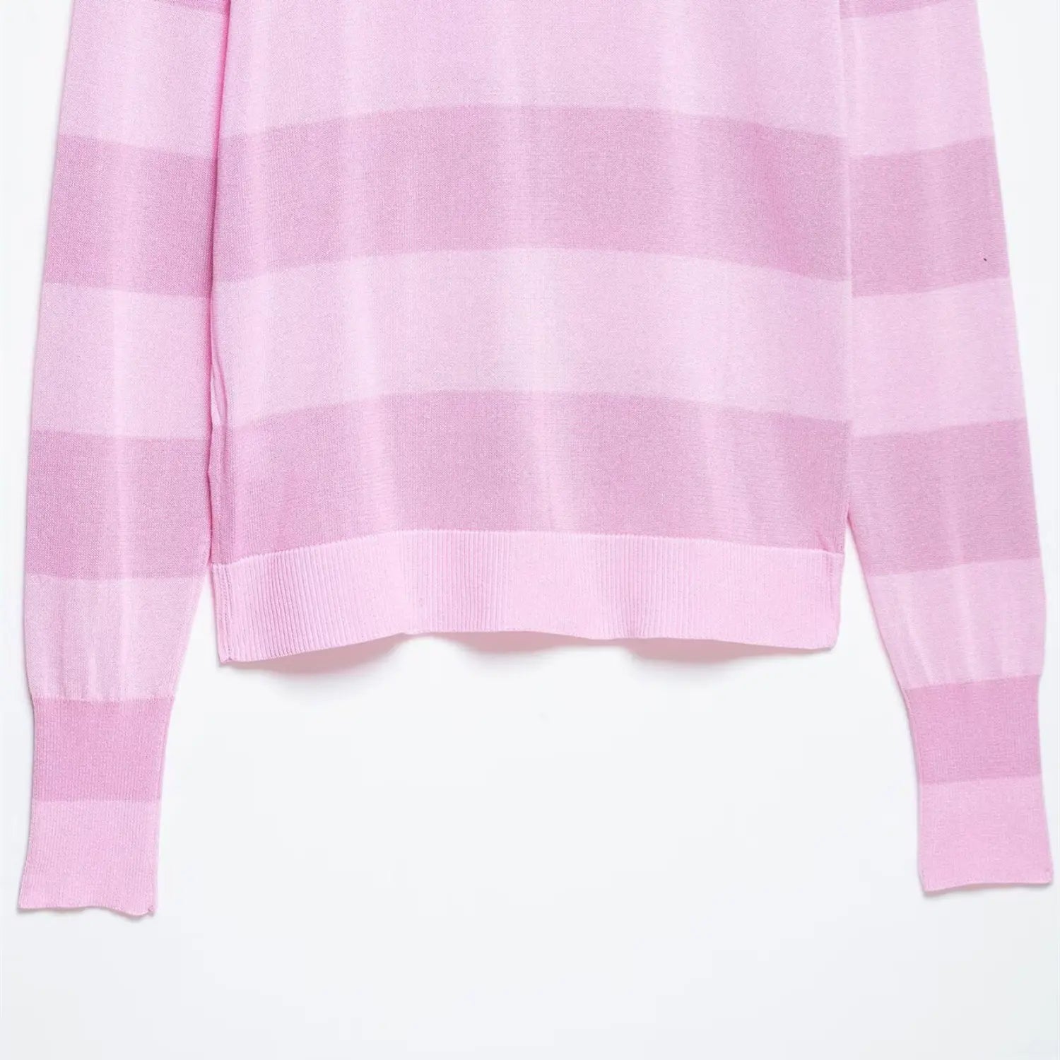Close-up of the ribbed sleeve cuff and hem on the pink striped knit cardigan