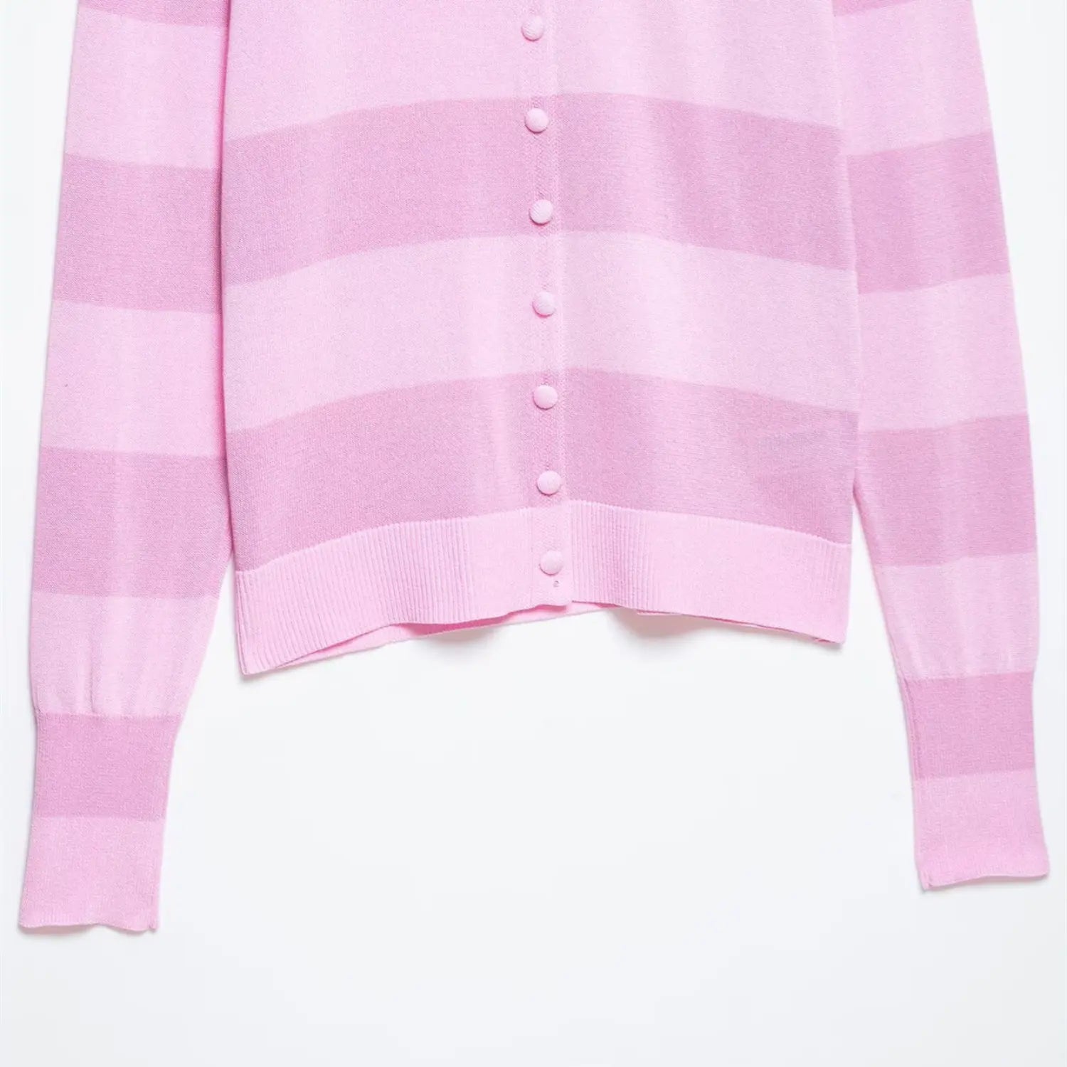 Close-up of the full-length button placket and ribbed hem on the pink striped knit cardigan