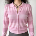 Lifestyle shot of model wearing the pink striped knit cardigan, showing the V-neck opening and relaxed fit