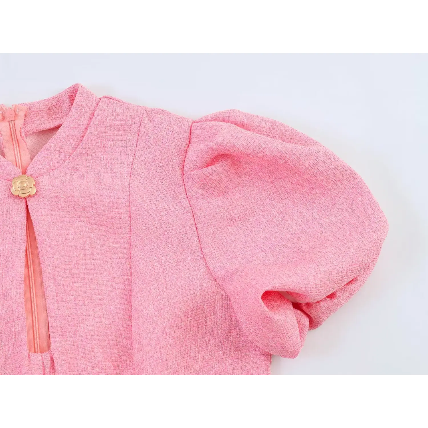 Front upper body close-up, stand cheongsam collar with keyhole cutout, puff short sleeve and central camellia clasp, back invisible zipper visible