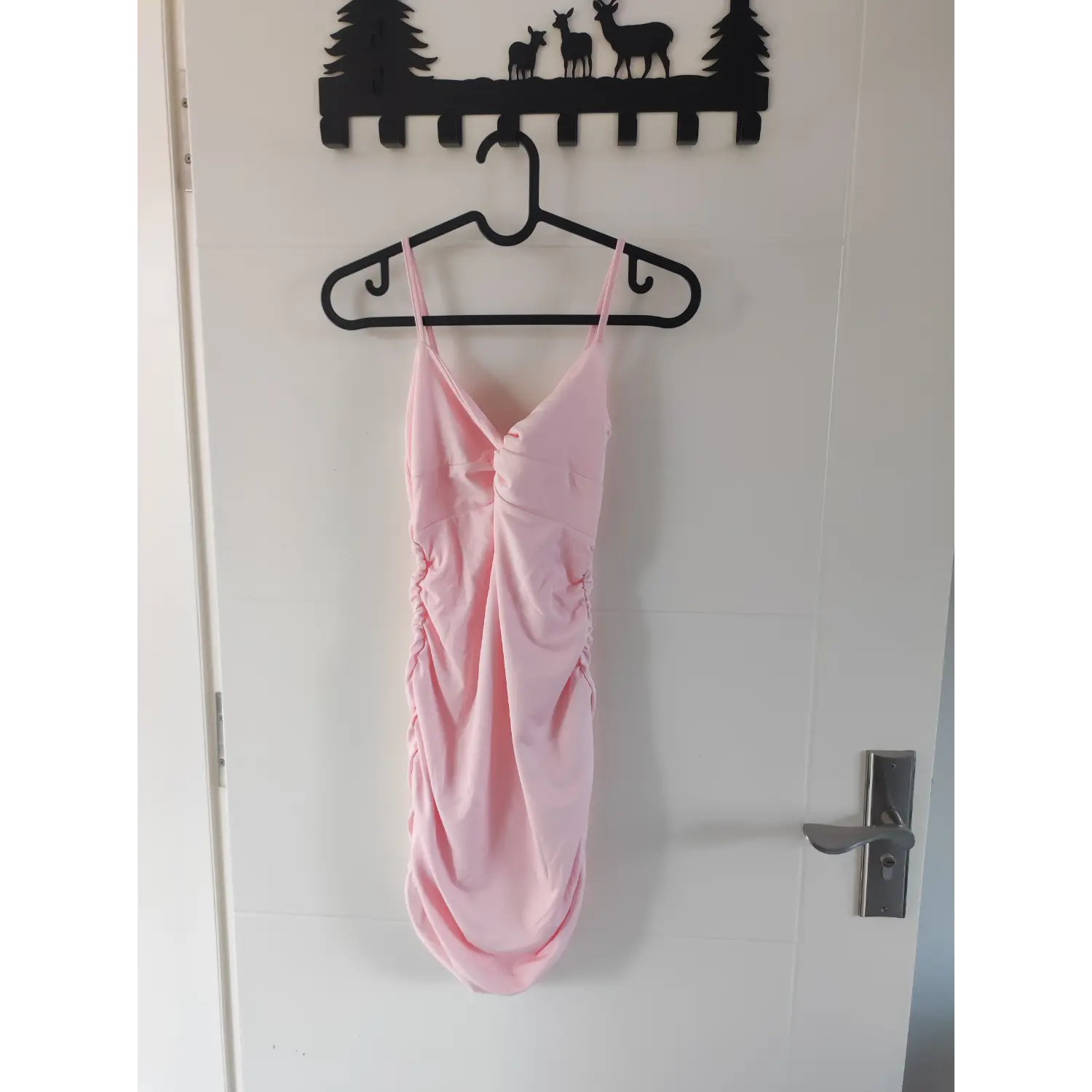 Full front hanging shot pink twist front ruched bodycon mini dress on plastic hanger