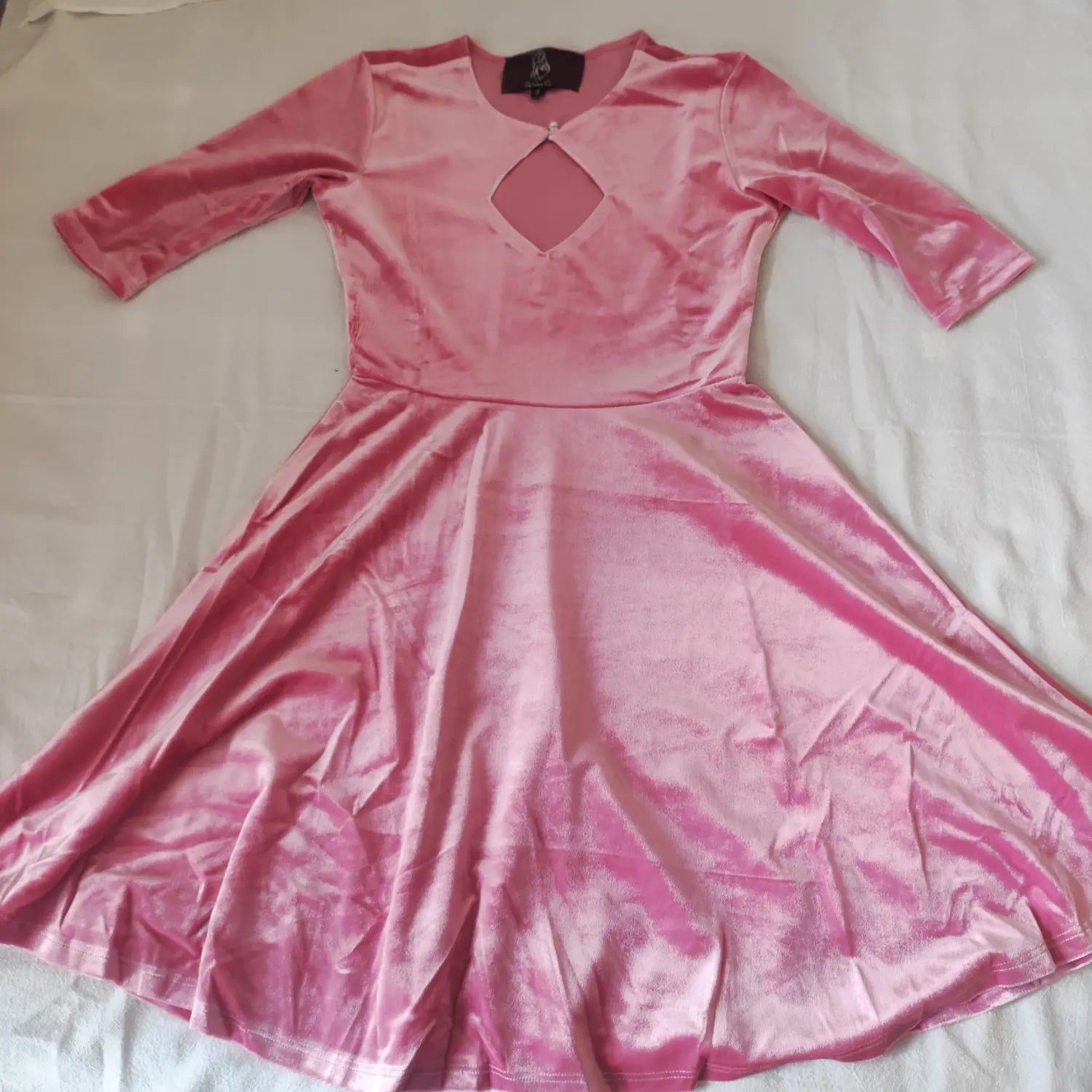 front-flatlay-view | Flat lay front view pink velvet mini dress, three quarter sleeves, diamond neck cutout detail