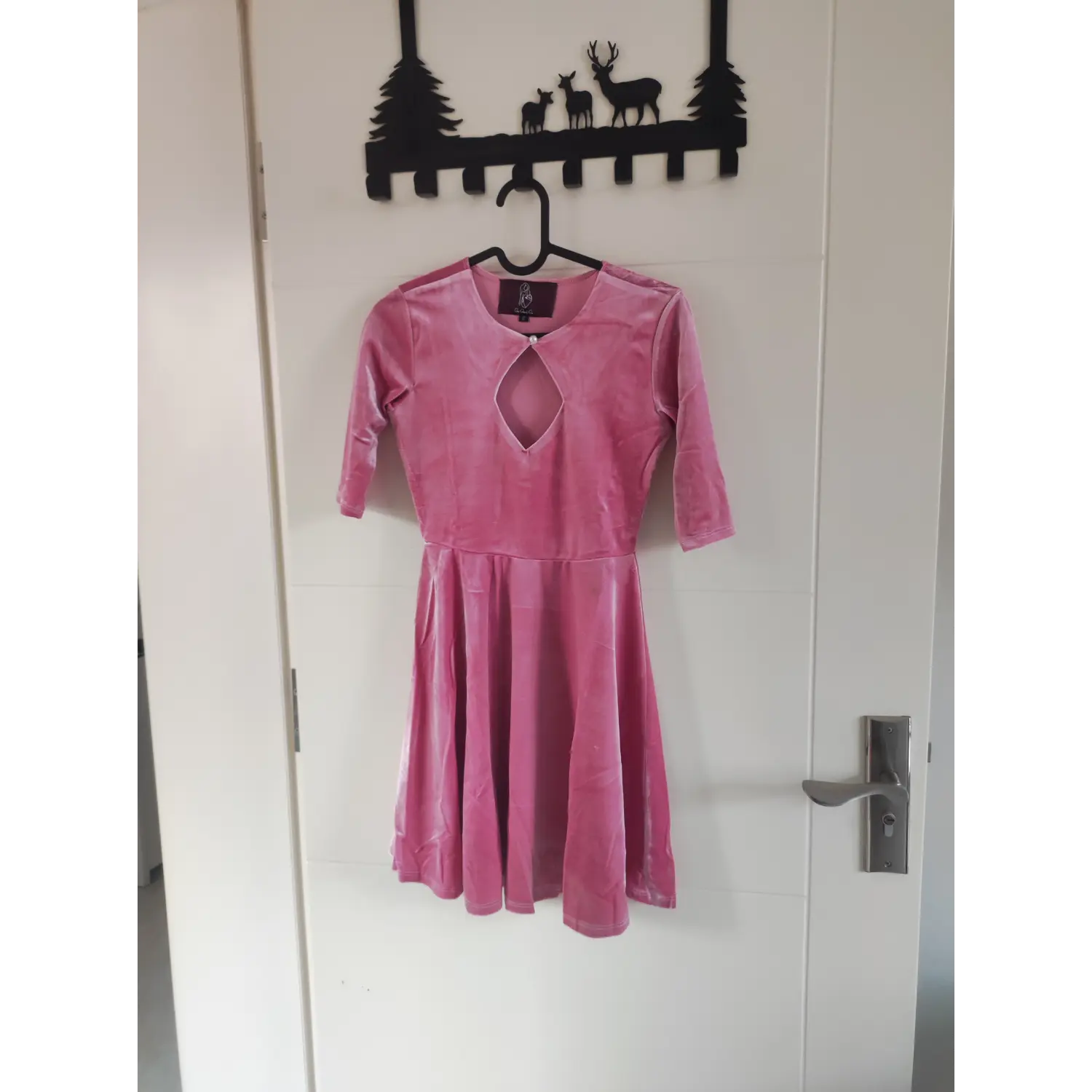 hanger-front-view | Front hanging shot pink velvet mini dress, diamond neck cutout, pearl button, three quarter sleeves