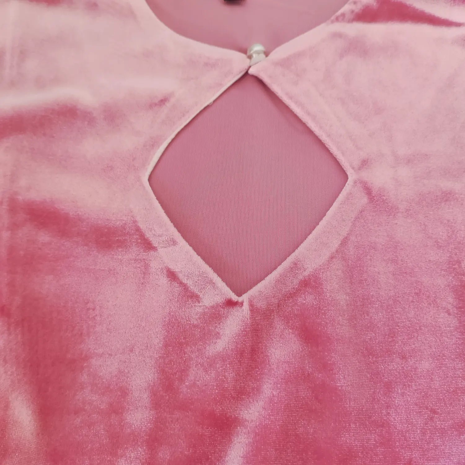 cutout-detail-view | Front diamond hollow cutout closeup, pearl button decor, shiny pink velvet women dress