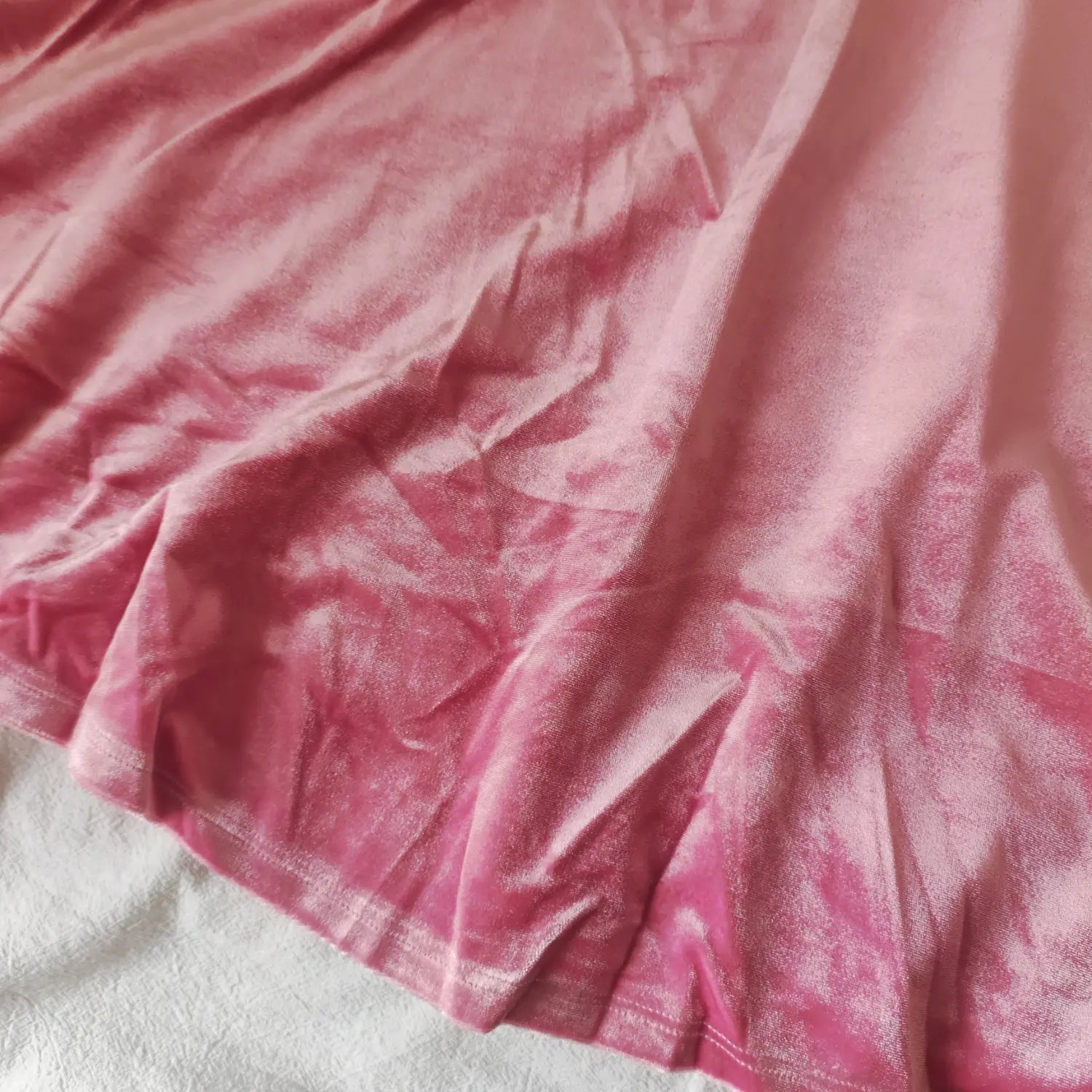 skirt-fabric-view | Pink velvet flared skirt closeup, stretch velvet texture, hem stitching of swing midi dress