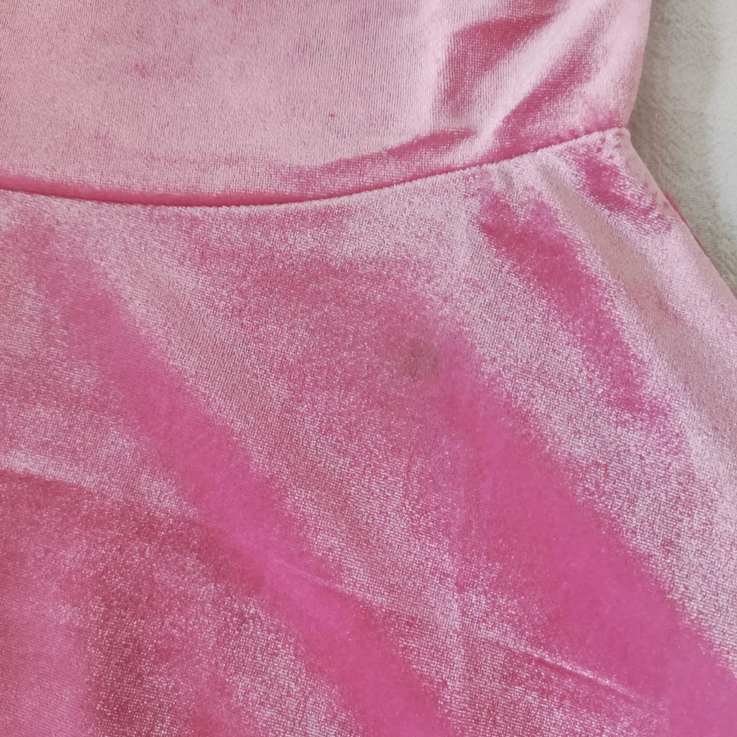 waist-seam-view | Close-up waist joint stitching, pink velvet fabric texture for fit and flare dress