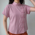 Front lifestyle model shot new chinese style blouse, mandarin stand collar, diagonal frog knot placket, relaxed cropped fit short dolman sleeves