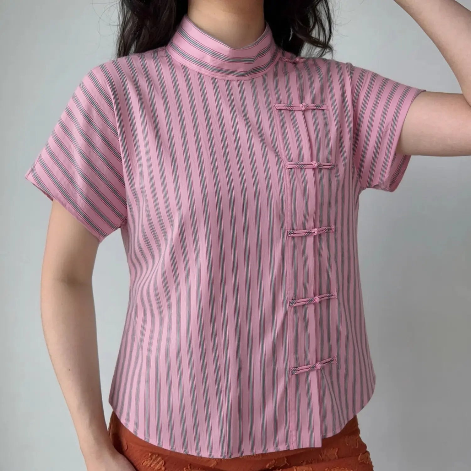 Front lifestyle model shot new chinese style blouse, mandarin stand collar, diagonal frog knot placket, relaxed cropped fit short dolman sleeves