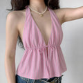 Front lifestyle shot on model of pink striped halter cami top, deep v front tie design, peplum flare hem, summer y2k casual outfit