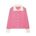 Pink knit cardigan with white cable texture collar and cuffs, button down long sleeve cropped sweater, front view